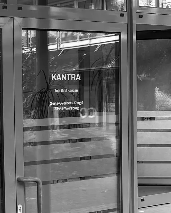 Entrance door of the Kantra office with the company name on the glass